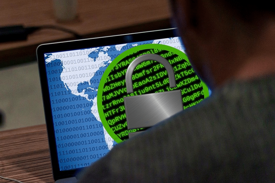 A hacker using a laptop