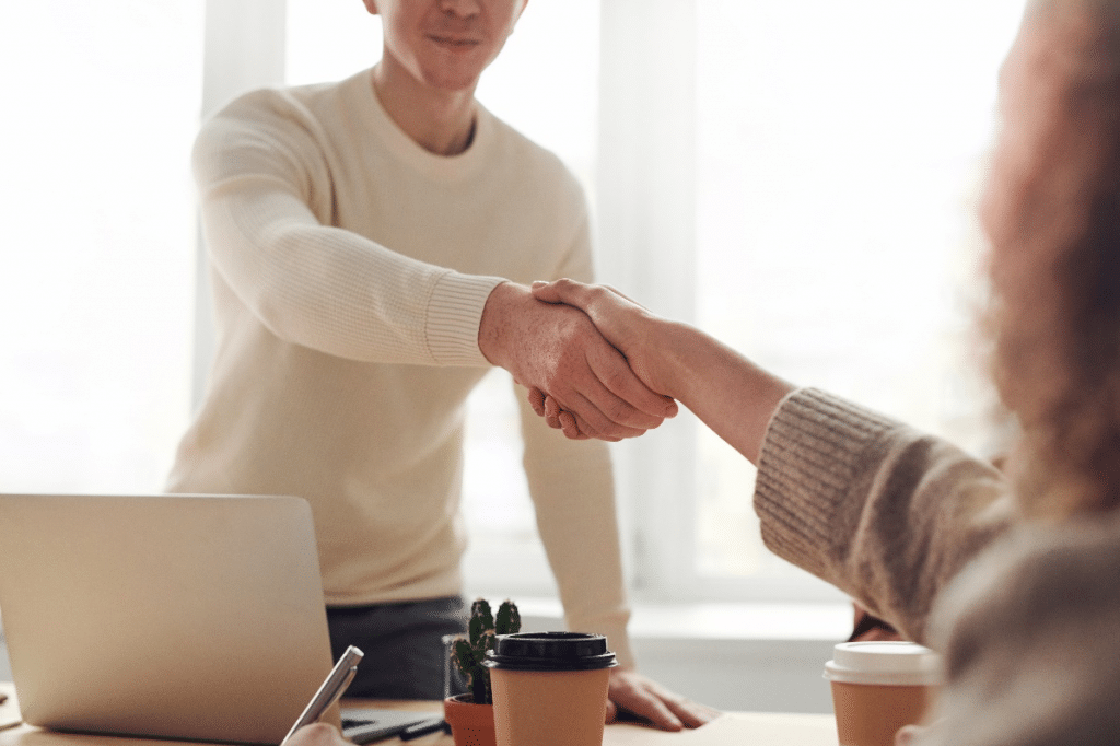 Business professionals shaking hand