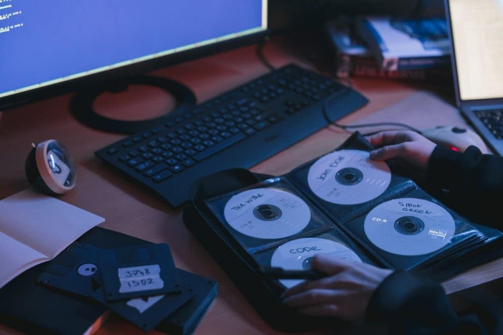 A person checking discs